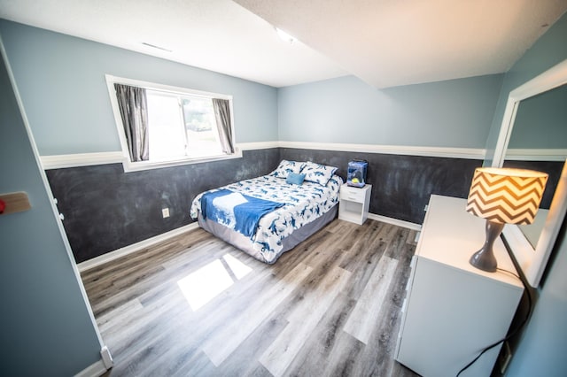 724 50th Ave NW, Rochester, MN 55901 - bedroom featuring wood finished floors and baseboards