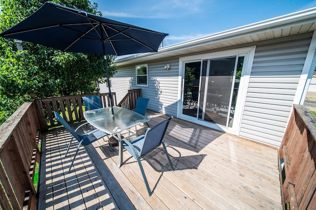 724 50th Ave NW, Rochester, MN 55901 - wooden deck with outdoor dining area
