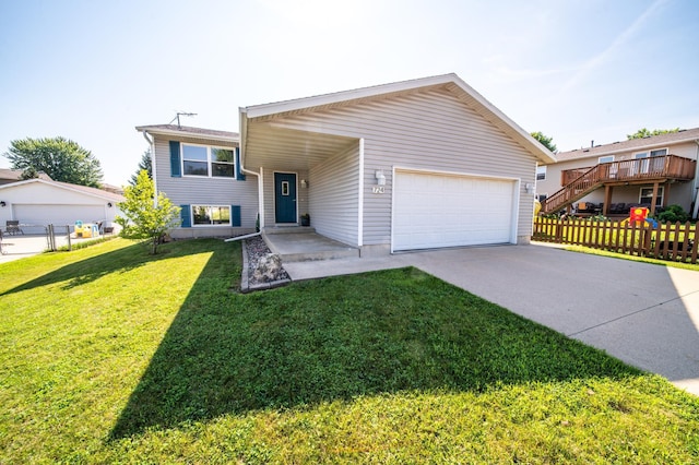 724 50th Ave NW, Rochester, MN 55901 - split level home with concrete driveway and an attached garage