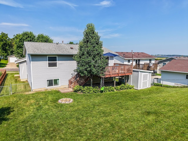 724 50th Ave NW, Rochester, MN 55901 - rear view of house with a storage shed, a wooden deck, stairs, roof with shingles, and a residential view
