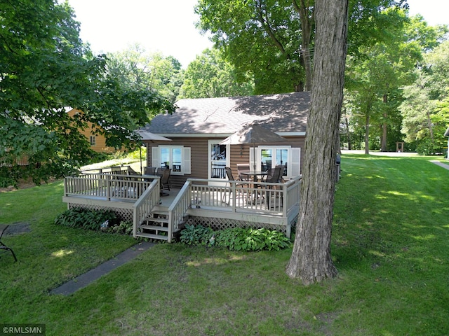 11436 Hoyer Ave NW, Annandale, MN 55302 - view of front of house featuring a shingled roof, a deck, and a front lawn