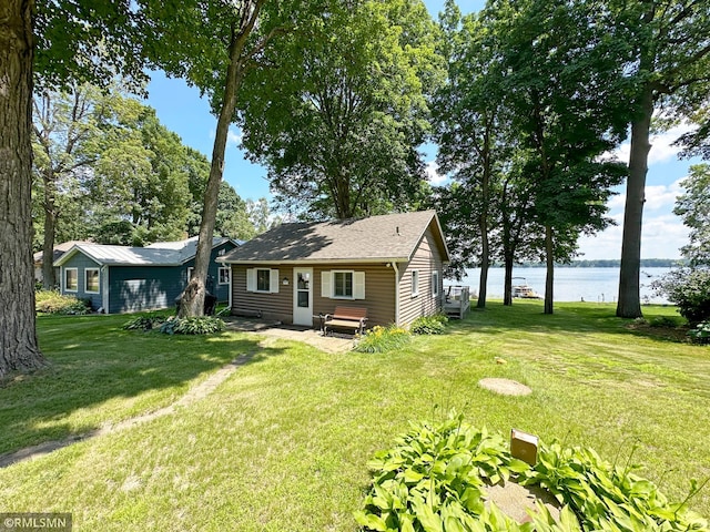 11436 Hoyer Ave NW, Annandale, MN 55302 - view of front of home featuring a water view, a front yard, and a patio area