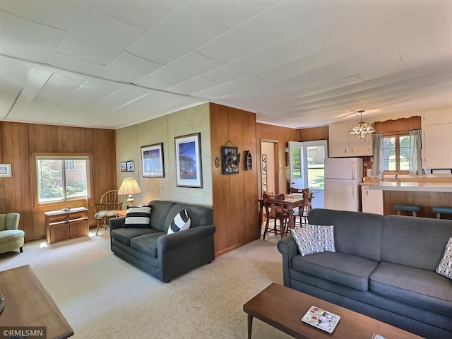 11436 Hoyer Ave NW, Annandale, MN 55302 - living area featuring wooden walls and light colored carpet