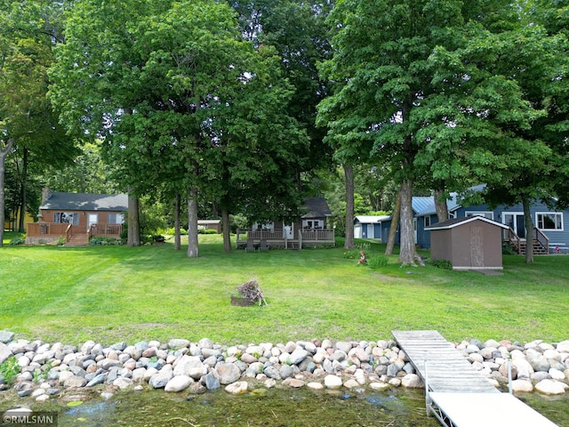 11436 Hoyer Ave NW, Annandale, MN 55302 - view of green lawn featuring a shed and a deck