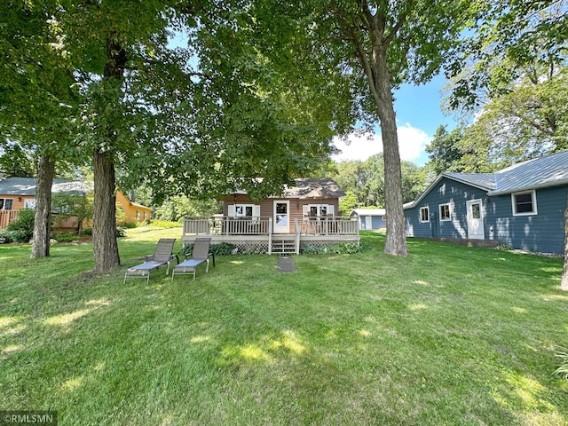 11436 Hoyer Ave NW, Annandale, MN 55302 - view of green lawn with a deck