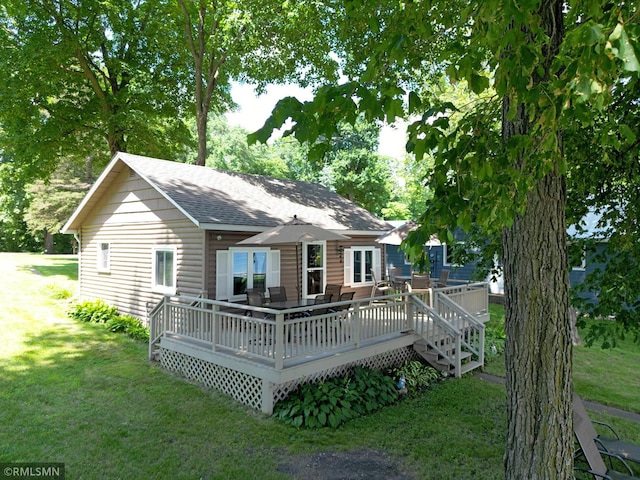 11436 Hoyer Ave NW, Annandale, MN 55302 - back of property with a yard, a wooden deck, and a shingled roof