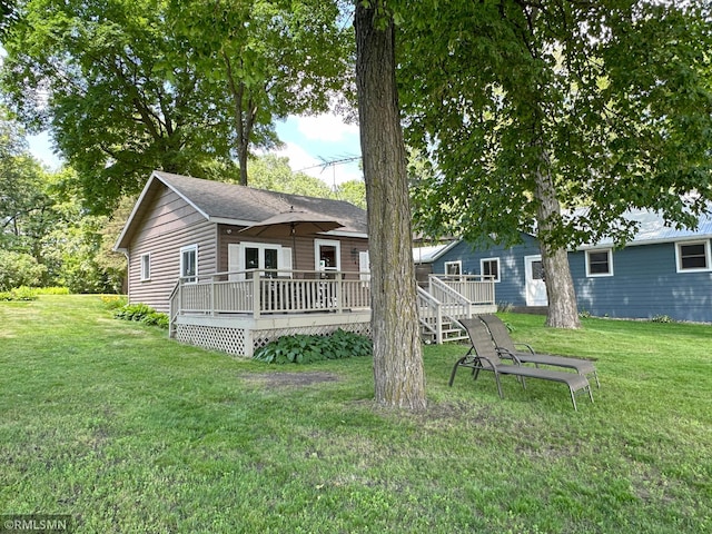 11436 Hoyer Ave NW, Annandale, MN 55302 - back of property featuring a deck and a yard