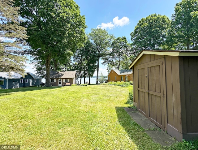 11436 Hoyer Ave NW, Annandale, MN 55302 - view of green lawn with a storage unit