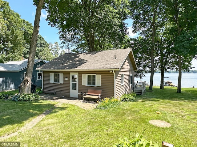11436 Hoyer Ave NW, Annandale, MN 55302 - rear view of property with a water view, a yard, and a shingled roof