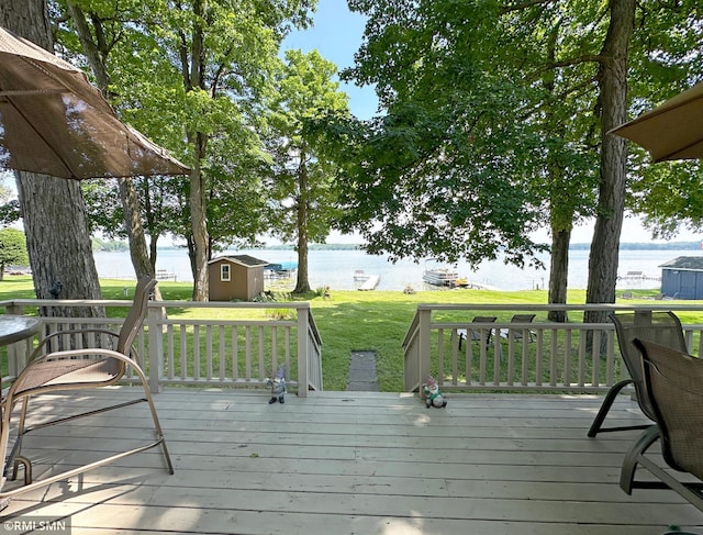 11436 Hoyer Ave NW, Annandale, MN 55302 - wooden terrace with a water view, a storage shed, and a lawn