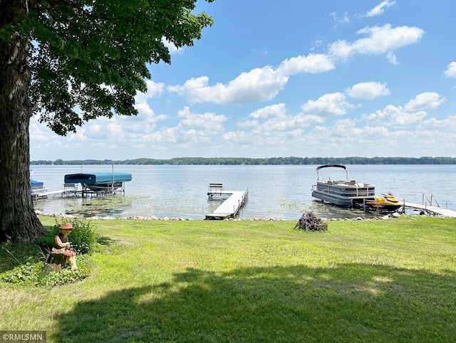 11436 Hoyer Ave NW, Annandale, MN 55302 - dock area featuring a lawn and a water view