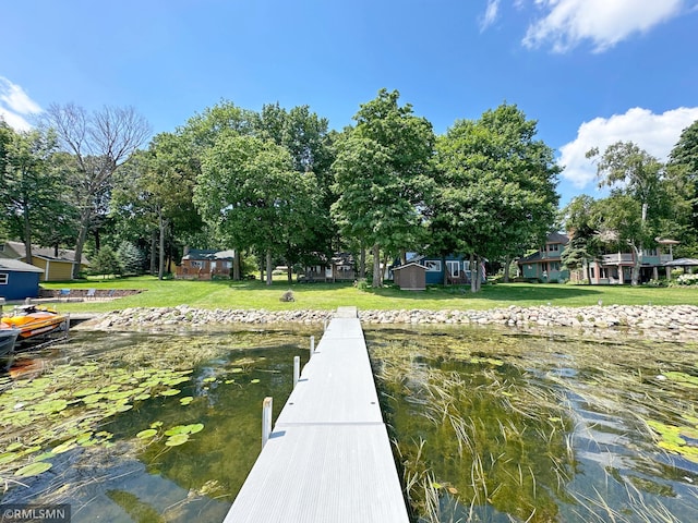 11436 Hoyer Ave NW, Annandale, MN 55302 - dock featuring a lawn and a water view