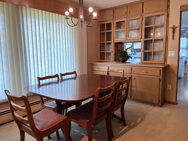 806 Highland Rd, Windom, MN 56101 - dining space with a chandelier and light colored carpet