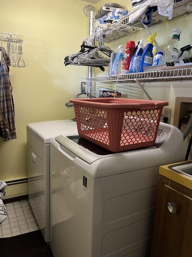 806 Highland Rd, Windom, MN 56101 - laundry room with separate washer and dryer, baseboard heating, and tile patterned floors