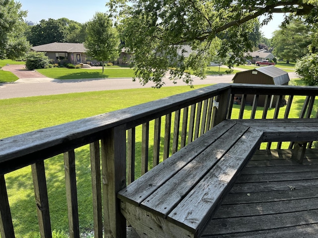 806 Highland Rd, Windom, MN 56101 - deck featuring a storage shed and a lawn