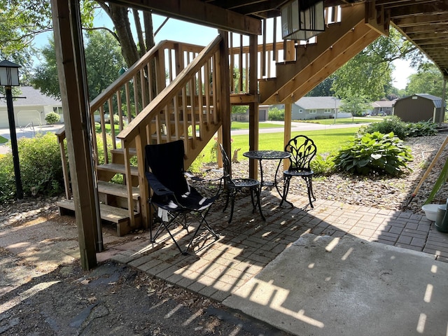 806 Highland Rd, Windom, MN 56101 - view of patio / terrace featuring stairway and a storage unit