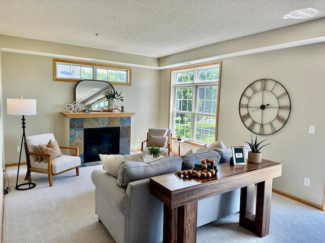 2100 Old School Rd Unit 206, Mound, MN 55364 - living room with light carpet, a tile fireplace, and a textured ceiling