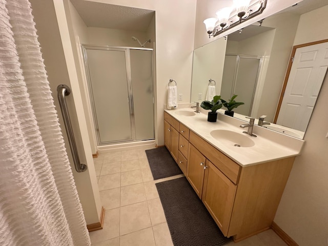 2100 Old School Rd Unit 206, Mound, MN 55364 - bathroom with a shower stall, double vanity, and tile patterned flooring
