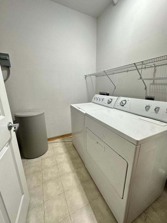 2100 Old School Rd Unit 206, Mound, MN 55364 - laundry room featuring independent washer and dryer and light tile patterned flooring