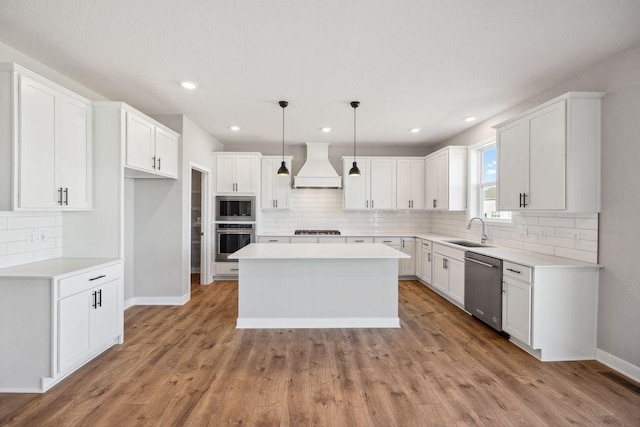 898 Laurel Ct, Chaska, MN 55318 - kitchen featuring premium range hood, stainless steel appliances, a center island, backsplash, and white cabinets