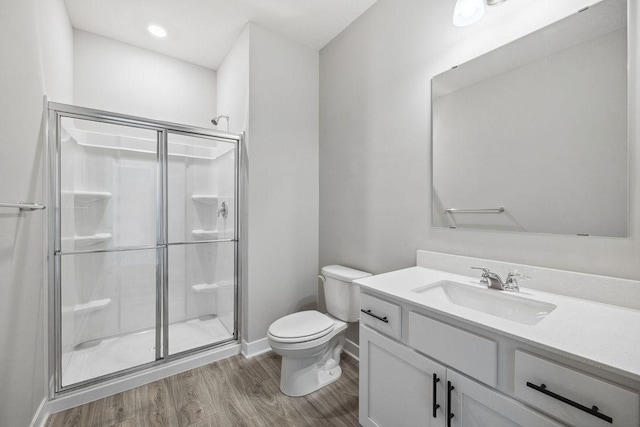 898 Laurel Ct, Chaska, MN 55318 - full bath featuring a stall shower, vanity, and wood finished floors