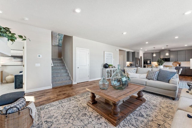 898 Laurel Ct, Chaska, MN 55318 - living room featuring light wood finished floors, stairs, and recessed lighting