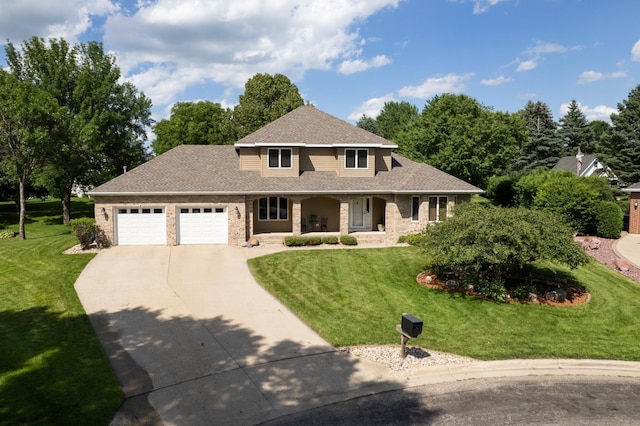 1201 Morningside Cir, Marshall, MN 56258 - view of front of home with a porch, driveway, a garage, and a front lawn