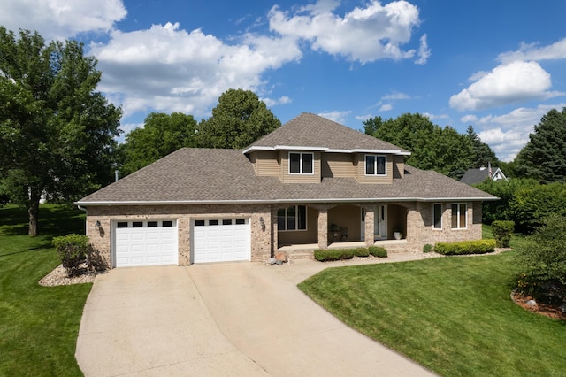 1201 Morningside Cir, Marshall, MN 56258 - view of front of home featuring driveway, covered porch, an attached garage, and brick siding