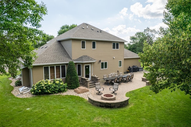 1201 Morningside Cir, Marshall, MN 56258 - rear view of house with an outdoor fire pit, a shingled roof, and a lawn