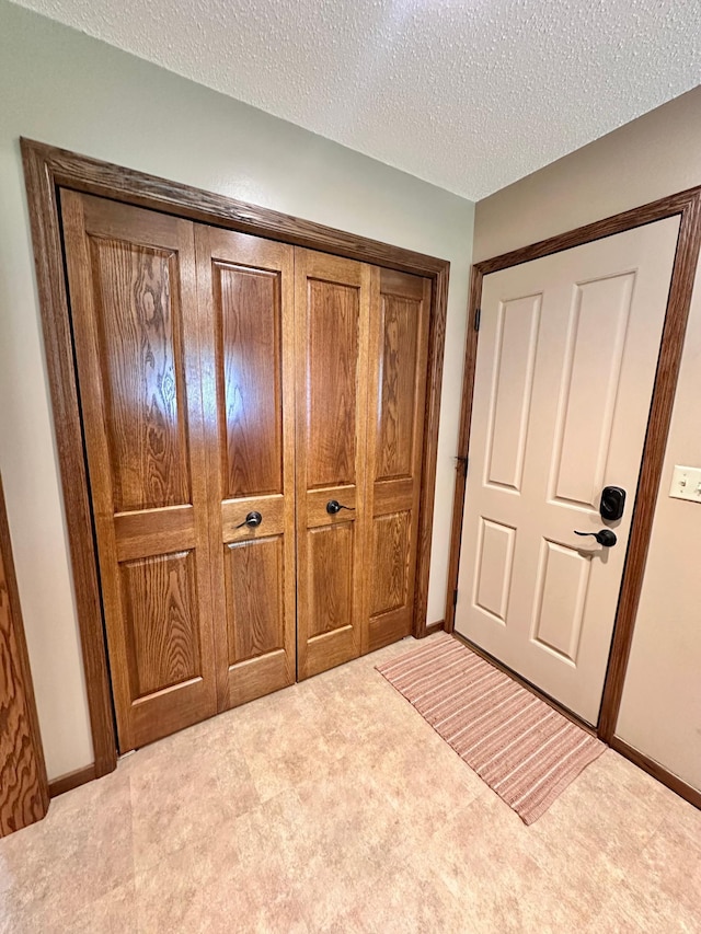 1201 Morningside Cir, Marshall, MN 56258 - foyer entrance with carpet and a textured ceiling
