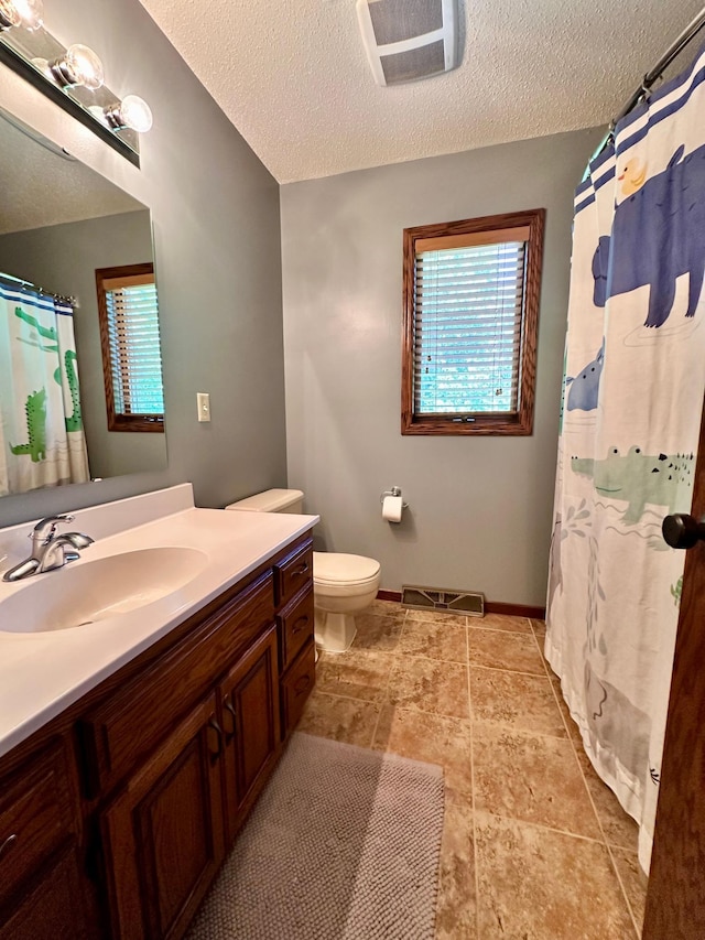 1201 Morningside Cir, Marshall, MN 56258 - bathroom with vanity, healthy amount of natural light, a textured ceiling, and a shower with curtain