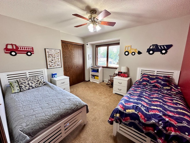 1201 Morningside Cir, Marshall, MN 56258 - bedroom with carpet flooring, a closet, ceiling fan, and a textured ceiling