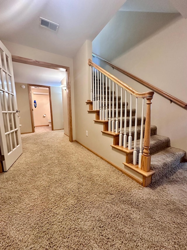 1201 Morningside Cir, Marshall, MN 56258 - stairs featuring carpet and baseboards