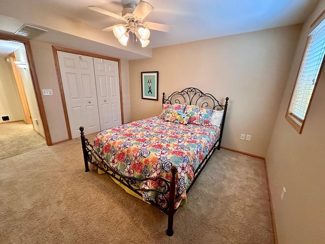 1201 Morningside Cir, Marshall, MN 56258 - bedroom featuring light colored carpet, a closet, and a ceiling fan