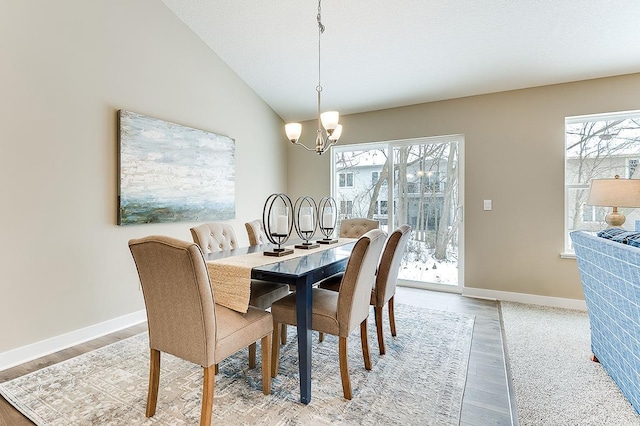 7085 Marlowe Ave NE, Otsego, MN 55330 - dining room featuring a chandelier, light wood finished floors, and lofted ceiling