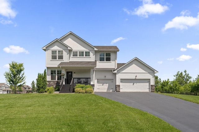 7850 242nd St, Wyoming, MN 55025 - craftsman inspired home with stone siding, driveway, a front yard, board and batten siding, and covered porch