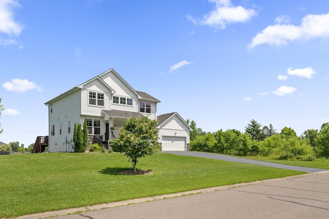 7850 242nd St, Wyoming, MN 55025 - view of front of house with driveway, board and batten siding, stone siding, and a front lawn