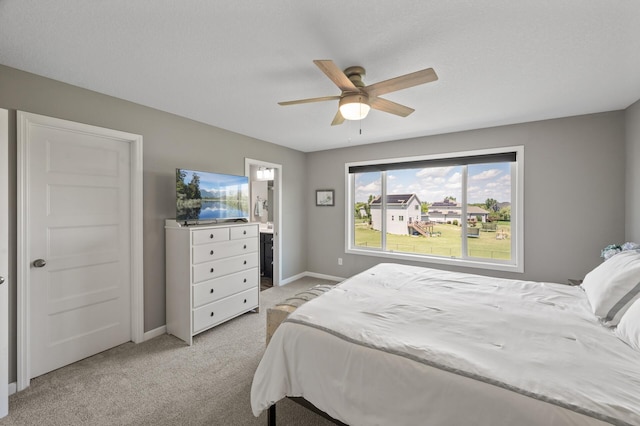 7850 242nd St, Wyoming, MN 55025 - bedroom with light carpet, a ceiling fan, and ensuite bathroom