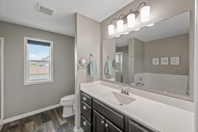 7850 242nd St, Wyoming, MN 55025 - full bath with vanity, wood finished floors, and a stall shower