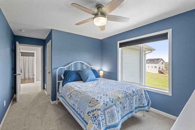 7850 242nd St, Wyoming, MN 55025 - carpeted bedroom with ceiling fan and a textured ceiling