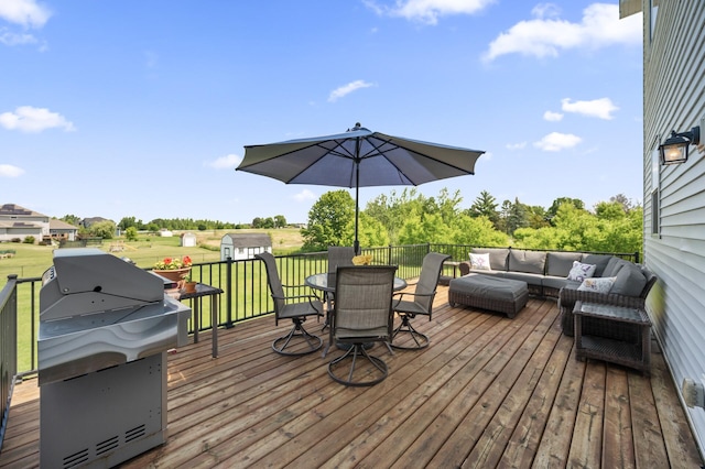 7850 242nd St, Wyoming, MN 55025 - deck with an outdoor living space, outdoor dining area, a grill, and a lawn