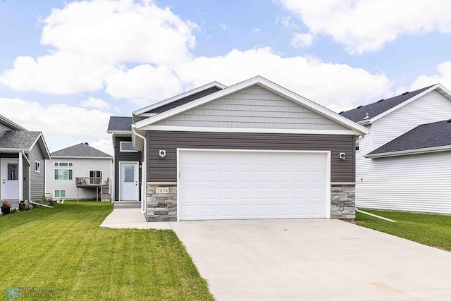 2054 12th St W, West Fargo, ND 58078 - craftsman inspired home featuring stone siding, a front yard, concrete driveway, and an attached garage