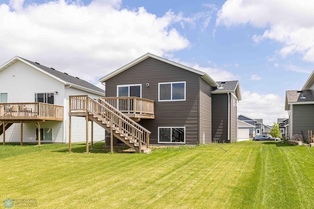 2054 12th St W, West Fargo, ND 58078 - back of house with stairs, a deck, and a yard