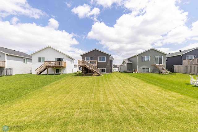 2054 12th St W, West Fargo, ND 58078 - back of property with stairway and a deck