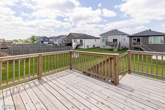 2054 12th St W, West Fargo, ND 58078 - wooden terrace with stairs, a residential view, and a fenced backyard