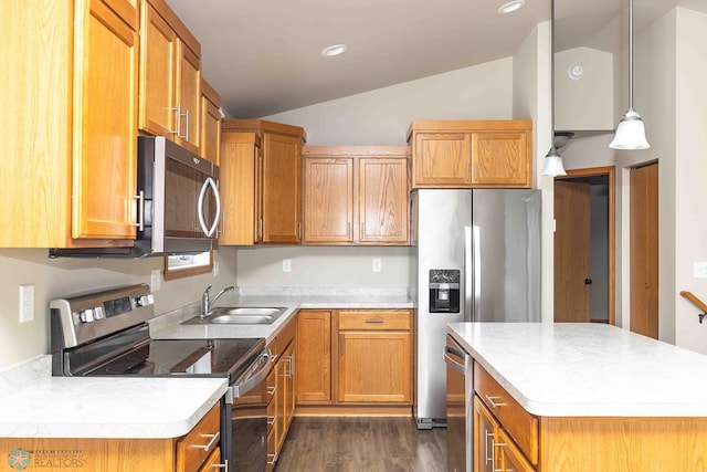 2054 12th St W, West Fargo, ND 58078 - kitchen featuring stainless steel appliances, vaulted ceiling, dark wood-type flooring, light countertops, and a kitchen island
