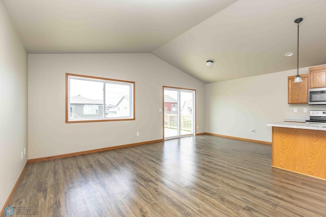 2054 12th St W, West Fargo, ND 58078 - unfurnished living room with wood finished floors and lofted ceiling