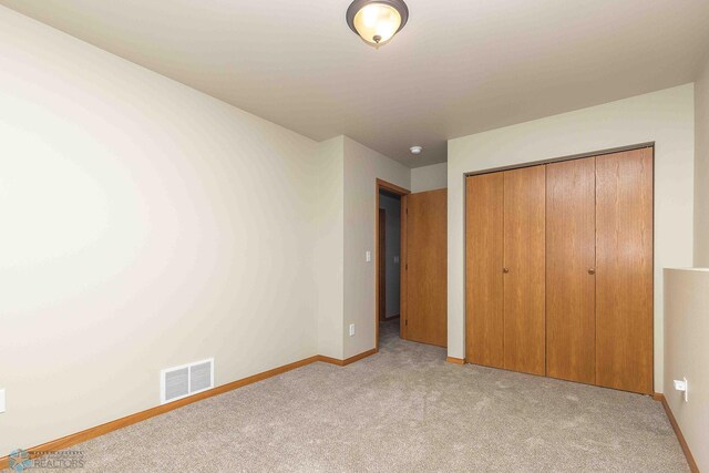 2054 12th St W, West Fargo, ND 58078 - unfurnished bedroom with light colored carpet and a closet