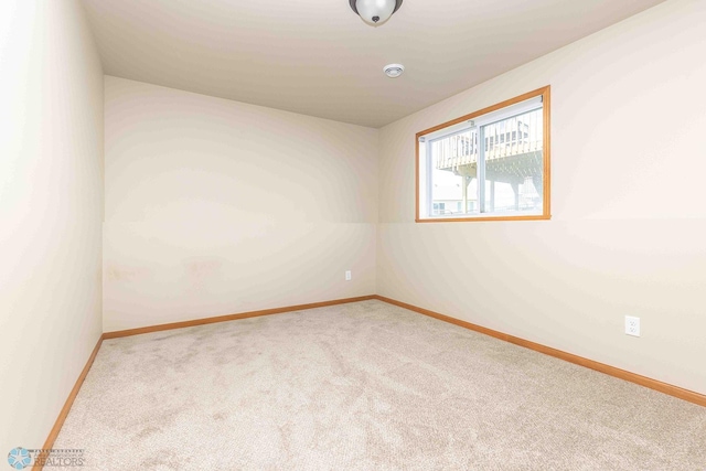2054 12th St W, West Fargo, ND 58078 - carpeted spare room with baseboards and a smoke detector