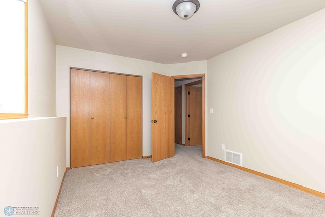2054 12th St W, West Fargo, ND 58078 - unfurnished bedroom with light colored carpet and a closet